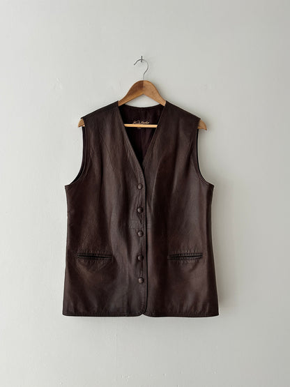 Brown leather vest on a wooden hanger against a white background