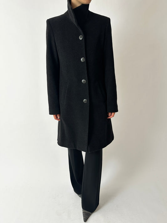 Long wool cashmere vintage black coat with large collar. A minimalistic statement piece for a modern timeless wardrobe