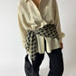vintage oversized silk shirt in soft butter worn with a silk dotted scarf around the waist. Both curated by NYN