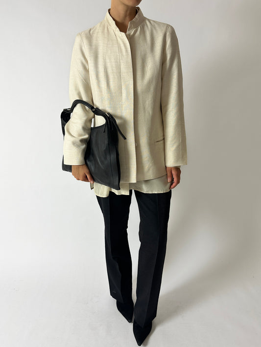 Vintage silk blend tailored blazer jacket in an off white hue. A clean modern statement piece to elevate your wardrobe. Curated by NYN