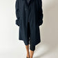 Vintage dark blue Mac coat a classic quality piece for all seasons worn with a black vintage capri and pointy mules. Curated by NYN 