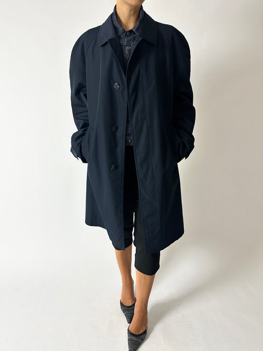 Vintage dark blue Mac coat a classic quality piece for all seasons worn with a black vintage capri and pointy mules. Curated by NYN 