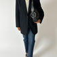 Vintage wool blazer night blue worn with a vintage Levis 501 in dark blue and leather shoulder bag with silver tone ring detail. Curated by NYN
