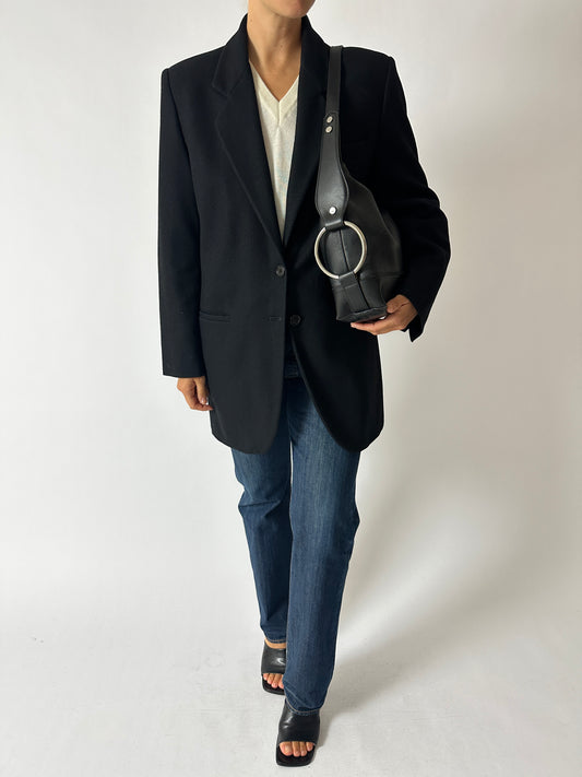 Vintage wool blazer night blue worn with a vintage Levis 501 in dark blue and leather shoulder bag with silver tone ring detail. Curated by NYN