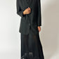 Vintage pleated maxi skirt in black worn with a collarless vintage blazer in off black. A timeless classic look with edge. Curated by NYN