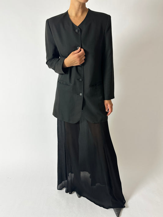 Vintage pleated maxi skirt in black worn with a collarless vintage blazer in off black. A timeless classic look with edge. Curated by NYN