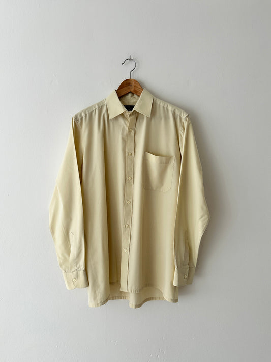 Vintage cotton shirt in a butter hue. A classic versatile piece for everyday wear. Curated by NYN